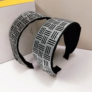 Detail of premium padded headband with sparkling white rhinestones in geometric pattern