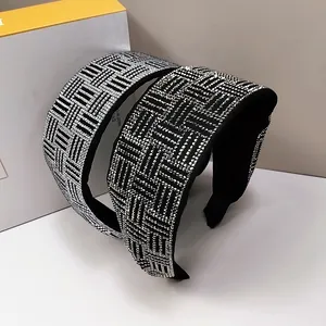 Macro view of wide headbands featuring shimmering silver rhinestones and grid patterns