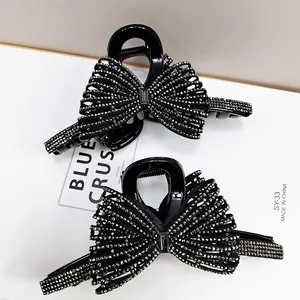 Set di fermagli per capelli a fiocco con strass neri per un'acconciatura elegante