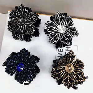 Elegant crystal flower hair claw clips in four colors with shimmering rhinestones and shiny finish