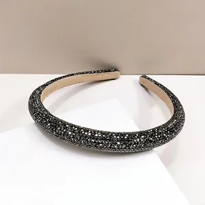 Macro shot of dark grey rhinestone headband with anti-slip beige velvet lining
