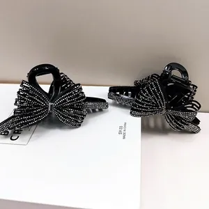 Grande molletta per capelli a fiocco nero con strass luminosi per acconciature donna