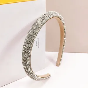 Detailed macro view of high-quality silver rhinestones encrusted on a luxury headband