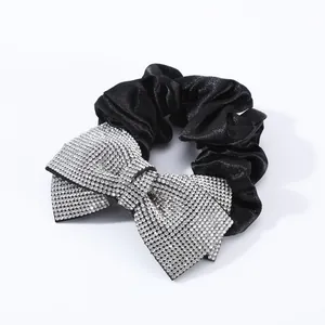 Elegant black satin hair tie with sparkling rhinestone bow detail for women hair styling