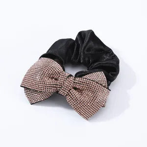 Elegant black satin hair scrunchie with large sparkling rhinestone bow hair accessory