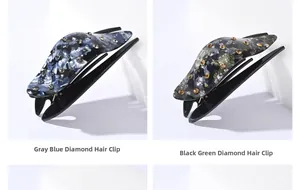Detail of grey-blue and dark green marble hair clips with sparkling rhinestone accents