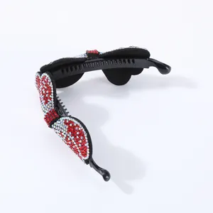 Elegante pinza banana con lazo y diamantes de imitación rojos y blancos mujer