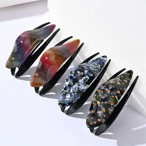 Elegant acrylic hair clip set with marble patterns and shimmering gradient finishes