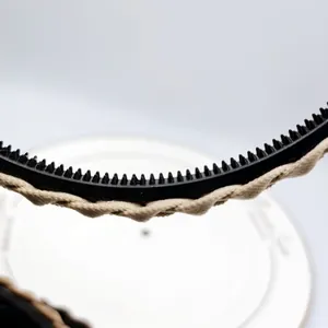 Detail of French vintage braided headband showing anti-slip teeth and fabric texture