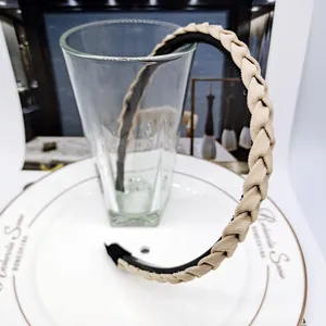Detail of khaki woven headband texture and non-slip inner teeth for secure hair grip