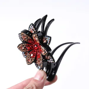 Elegant flower hair claw clip with colorful rhinestones and black resin finish