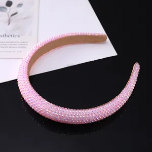 Close-up of pink rhinestones on a stylish sponge headband with soft velvet inner lining
