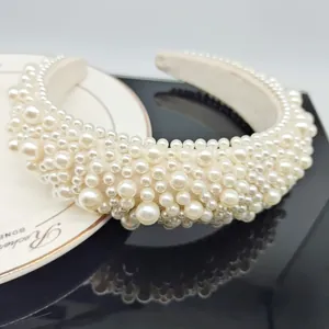 Baroque ivory sponge headband with hand-stitched pearls for elegant wedding and party styling