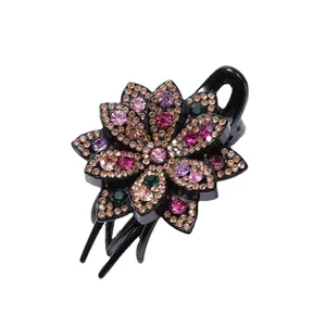 Elegant floral hair claw clip featuring colorful rhinestones in a refined flower design