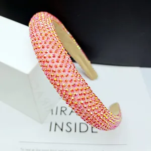 Close-up of pink rhinestone padded headband with sparkling gradient gems and fabric lining