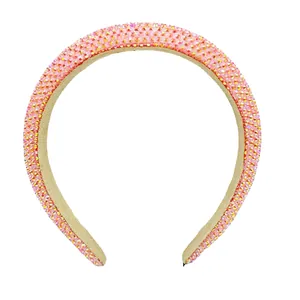 Elegant pink rhinestone padded headband with sparkling crystals for a high skull top style