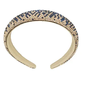 Cerchietto imbottito con strass luccicanti e motivo animalier blu e champagne