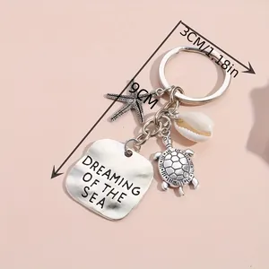 Ocean themed keychain with silver sea turtle, starfish, shell and engraved metal tag
