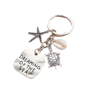 Ocean themed keychain with starfish turtle seashell and Dreaming of the Sea metal tag