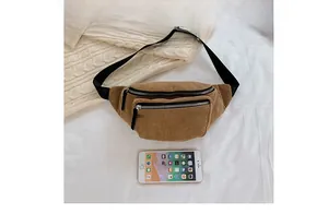 Detail view of khaki corduroy fanny pack showing fabric texture and adjustable strap