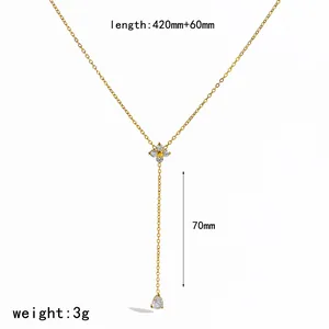 Detail view of gold Y-shaped clover necklace with teardrop CZ and dimension markings