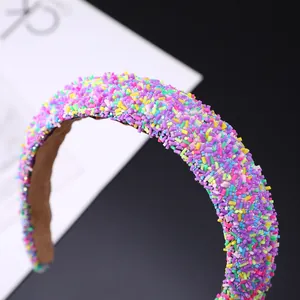 Detail of colorful beads on baroque headband with non-slip velvet inner lining