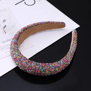 Macro shot of colorful sparkling crystal embellishments on the padded sponge headband
