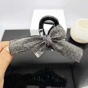 Elegant black ribbon bow hair claw clip with sparkling rhinestones for women hair styling