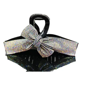 Sparkling rhinestone bow hair claw clip in black resin for elegant women hair styling