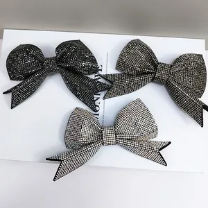 Elegant rhinestone bow hair clip set in black, gunmetal, and champagne gold colors