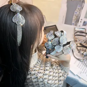Elegant headband with rhinestone bow design shown in multiple colors on a model