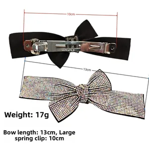 Detail showing the 10cm metal spring clip and 13cm crystal bow design on a 17g hair clip