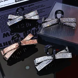 Sparkling rhinestone bow hair claw clips in silver and rose gold for thick hair styling