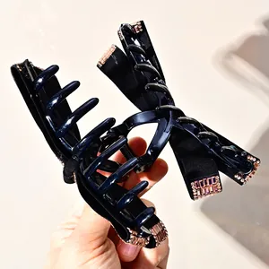 Black velvet bow hair claw clip with pink rhinestones for thick hair styling