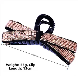 Detail showing 13cm length of large bow hair claw with sparkling champagne rhinestones