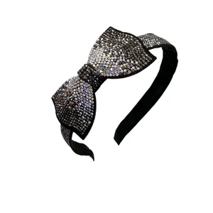 Serre-tête élégant en tissu noir orné d'un grand nœud en strass brillants pour femme