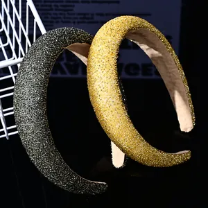 Macro view of crystal seed beads on padded wide headbands in green and yellow