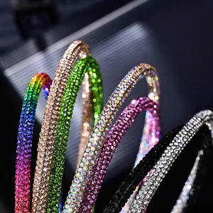 Macro detail of slim crystal headbands showcasing sparkling multicolored rhinestones