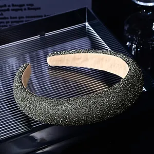 Close-up of grey crystal beaded headband with luxury thick padded design and non-slip lining