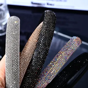 Close-up of five luxury high-density rhinestone headbands in various colors for women