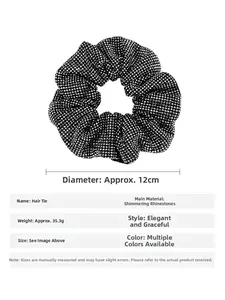 Detail view of a black scrunchie with sparkling rhinestones and 35.3g weight specification
