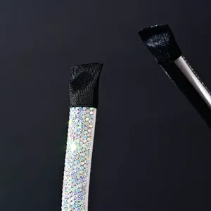 Macro shot of luxury headband with colorful rhinestones and soft black fabric ends