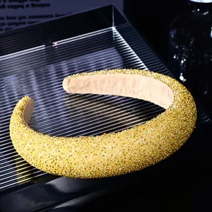 Detail of elegant gold beaded headband with soft velvet inner lining for comfort
