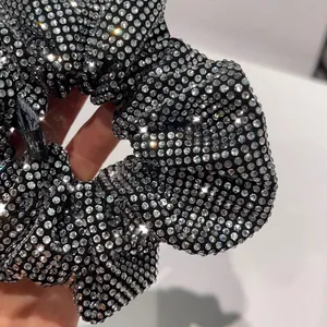 Sparkling black rhinestone scrunchie with crystal embellishments for chic hair styling