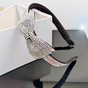 Elegant headband with AB colorful rhinestones and a large bow design for hair styling