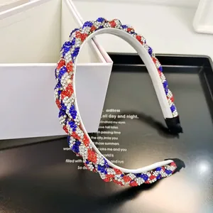 Macro detail of rhinestone headband with patriotic red white and blue braided twist design