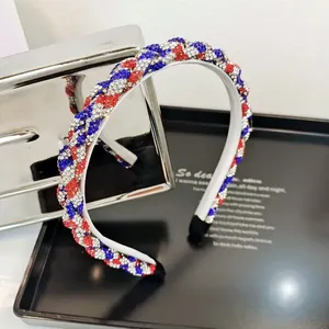 Detail of hand-woven headband with red, blue and white rhinestones on a metal base