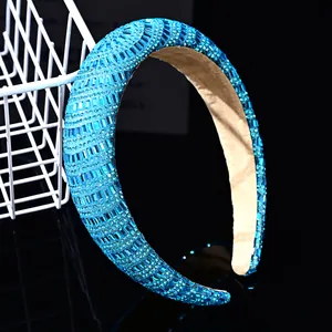 Detail of blue rhinestone padded headband with sparkling crystals and non-slip lining
