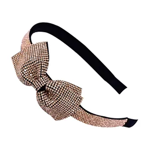 French vintage headband with bow and rose gold rhinestones on a white background