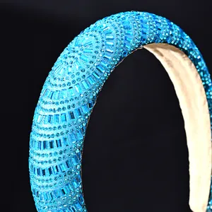 Macro close-up of blue rhinestones on a thick padded baroque style fashion headband
